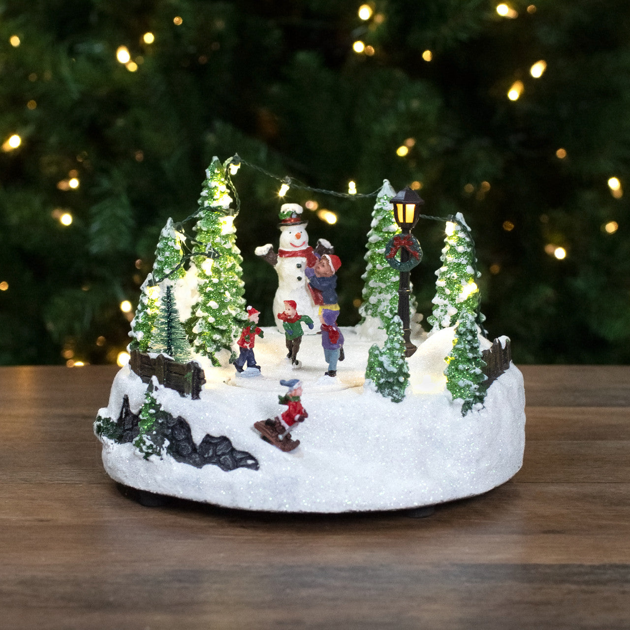 9" Lighted Christmas Scene with Moving Skaters and a Snowman