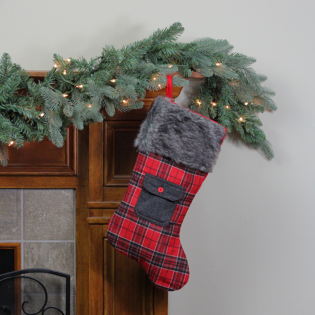 20.5" Red and Black Plaid Christmas Stocking with Pocket and Faux Fur Cuff